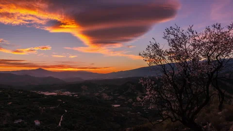 Timelapse of a conic lenticular cloud on sunset 4K ProRes 422HQ Stock Footage 310056538