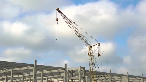 Timelapse of Construction Crane and Concrete Frame Structure Under Blue Sky 库存影片 338350393