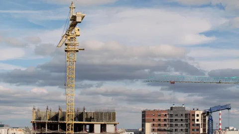 Timelapse construction site with tower crane and buildings Stock Footage 323870095