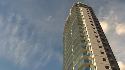 Timelapse of the construction of tall building with crane installation. Stock Footage 84334852