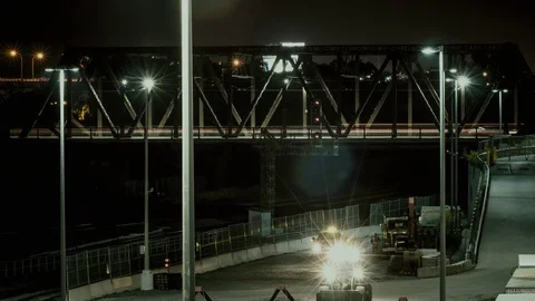 Timelapse with construction workers under Bathurst bridge in Toronto at night Stock Footage 104536158