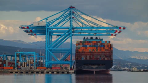 Timelapse of container ship offloading cargo in a port terminal with quay Stock Footage 333291123