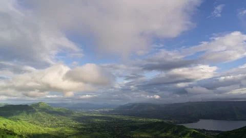 Timelapse - Cotton candy clouds over a valley 4K60 Stock Footage 270082854