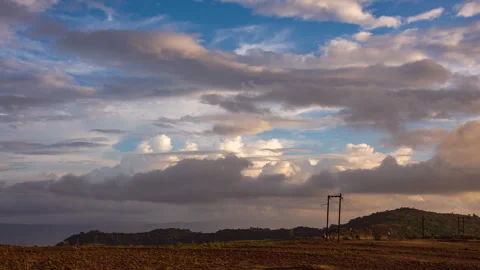 Timelapse - Cotton candy clouds over mountains 4K30 Stock Footage 270141104