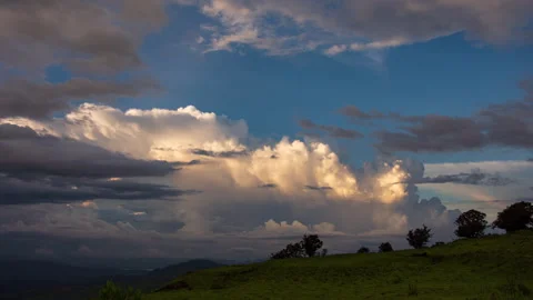 Timelapse - Cotton candy clouds over mountains 4K30 Stock Footage 270144202
