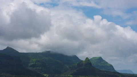 Timelapse - Cotton candy clouds over the mountains 4K30 Stock Footage 270320853