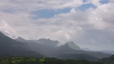 Timelapse - Cotton candy clouds over the mountains 4K30 Stock Footage 270320999