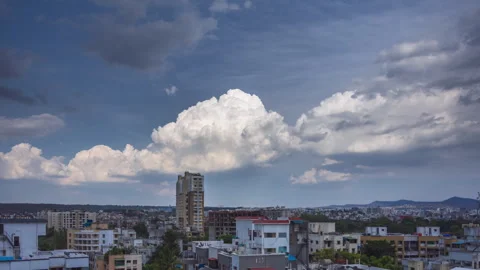 Timelapse - Cotton candy clouds over a city 4K60 Stock Footage 271018325