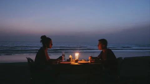Timelapse of Couple having Romantic Dinner on Beach Stock Footage 54634924