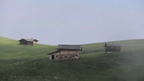 Timelapse of cows by a cabin in the mounains while clouds are passing by Stock Footage 211822345
