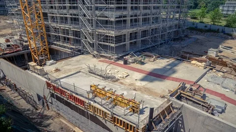 Timelapse crane shadow moving on construction site Stock Footage 158638223
