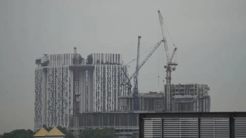 Timelapse of cranes with backdrop of Singapore HDB Stock-Footage 237220675