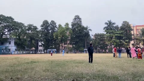 Timelapse of cricket field with young players playing and exercising. Stock Footage 167621420