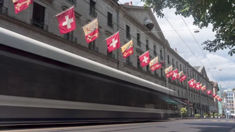 Timelapse of a crowded street with flags and blurred public transport Stock Footage 249390881