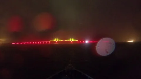 Timelapse of a cruise ship going under a bridge at night in Tampa Stock Footage 264932373
