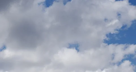 Timelapse of cumulous cloud moving through the sky during the day. Stock Footage 132300043