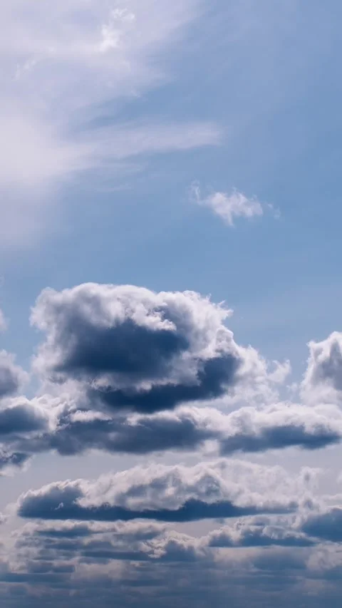 Timelapse of Cumulus Clouds Drifting in Vertical Format Stock Footage 306301057