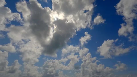 Timelapse of cumulus clouds moves in the blue sky. Stock Footage 329769151