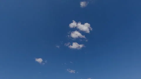 Timelapse of cumulus clouds moves in the blue sky. Stock Footage 330788212