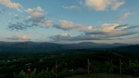 Timelapse of cumulus clouds moving in the blue sky above the mountains and Stock Footage 261492886