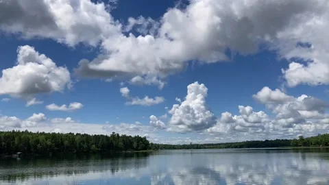 Timelapse Cumulus clouds over calm water 3862 Stock Footage 173855996