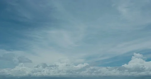 Timelapse - Cumulus clouds over the ocean in the afternoon Stock Footage 105792656
