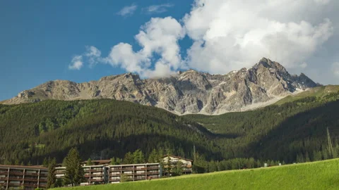 Timelapse of dancing clouds above the mountains. Mountain landscape. Piz Mi.. Video stock 244421527