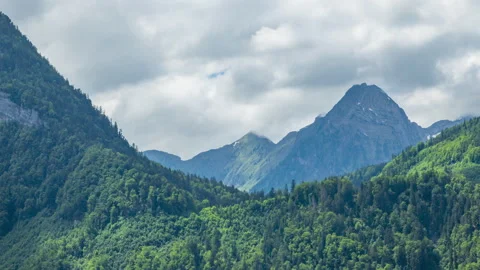 Timelapse of dancing clouds above the mountains. Mountain landscape. Glarus.. Video stock 244422171