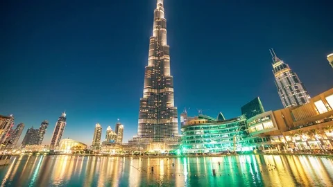 Timelapse dancing fountain near Burj Khalifa illuminated by the city at night Stock Footage