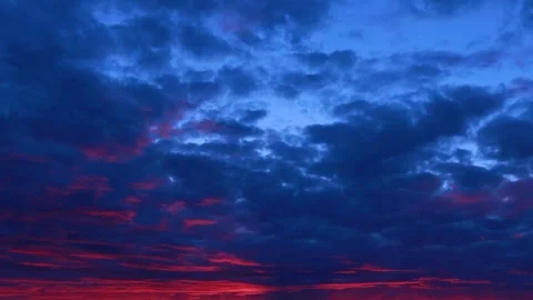 TIMELAPSE Dark blue and red sunset sky cloud background Slow motion epic storm Stock Footage 247453799