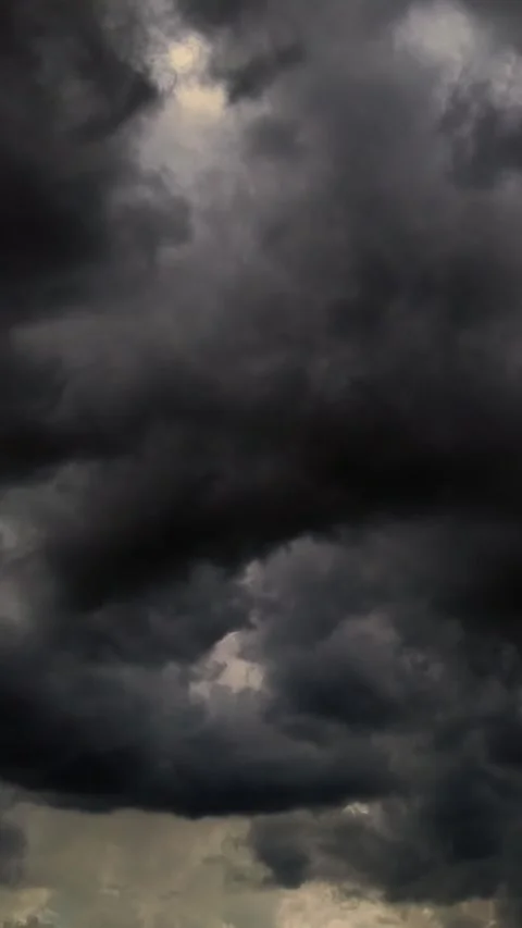Timelapse, dark blue sky, running grey thunder clouds, rain clouds. rare rays of Stock Footage 310703471