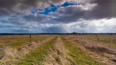 Timelapse Dark Clouds Above Field Stock Footage 104435897