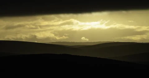 Timelapse of dark clouds and light over the hills Stock Footage 307655945