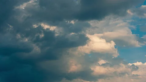 Timelapse of dark Clouds forming against blue sky Stock Footage 132969187