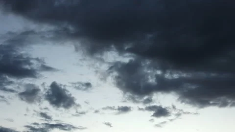 Timelapse - Dark clouds move across the evening sky in the blue hour. Birds fly 스톡 동영상 164670157