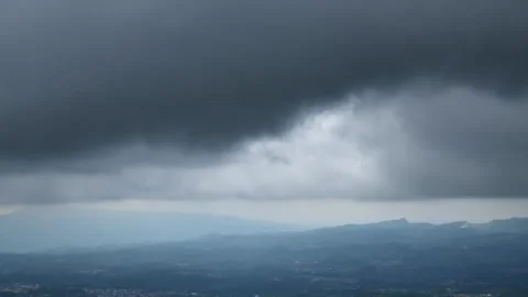Timelapse of dark clouds over the valley Stock Footage 295032786