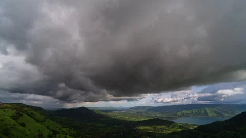 Timelapse - Dark monsoon storm coluds over a valley 4K60 Stock Footage 270142717
