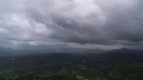 Timelapse - Dark monsoon storm coluds over a valley 4K30 Stock Footage 270144340