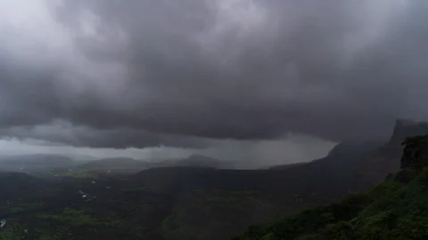 Timelapse - Dark monsoon storm coluds over a mountain 4K60 Stock Footage 270144374