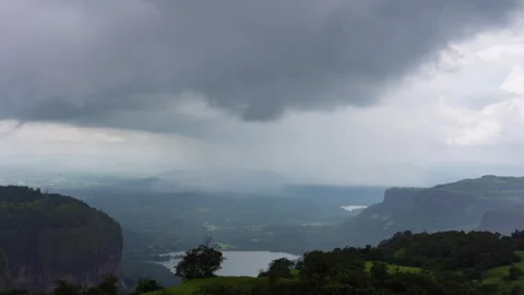 Timelapse - Dark monsoon storm coluds over a valley 4K30 Stock Footage 270320909