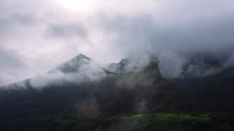 Timelapse - Dark monsoon storm coluds over a mountain 4K30 Stock Footage 270893875