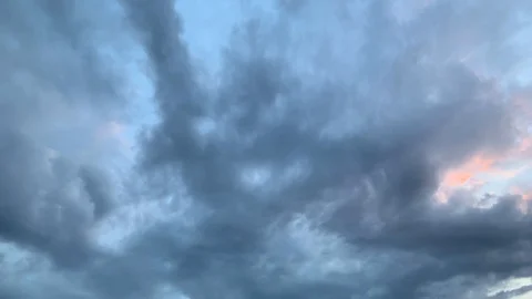 Timelapse Dark rain clouds pass by during the sunset 2 Stock Footage 108486753