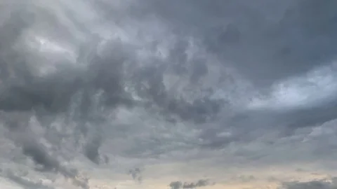 Timelapse Dark rain clouds pass by during the sunset Stock Footage 108487154