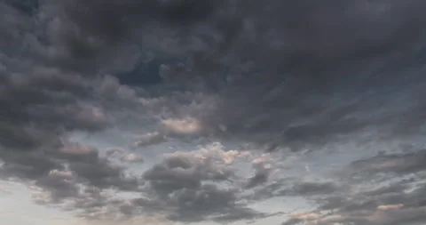 Timelapse dark storm clouds dramatic black sky background. Dark clouds before th Stock Footage 253868196
