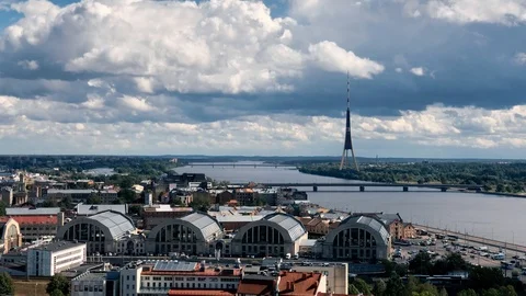Timelapse of Daugava River and Riga Skyline - Radio TV Tower and Central Market Stock Footage 122378274