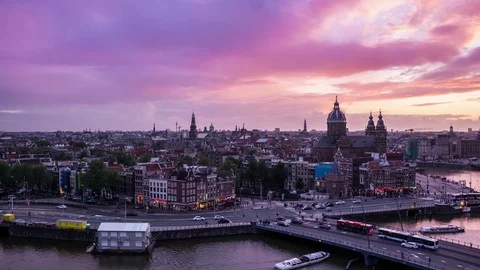 Timelapse day to night of Amsterdam skyline at sunset. The Netherlands, Europe. Stock Footage