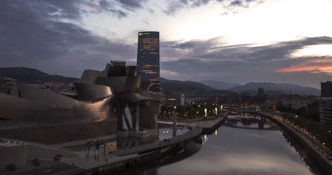 Timelapse Day To Night Guggenheim Museum Art Gallery Bilbao Spain Basque River Stock Footage