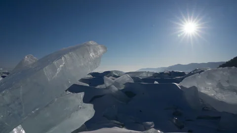 Timelapse of day to night sunset trough transparent piece of icicle Stock Footage 174703150