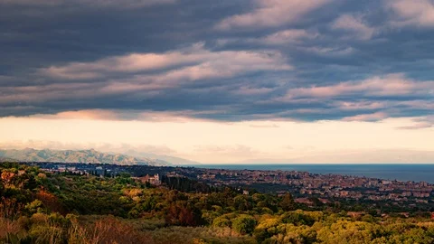 Timelapse day to night view of a sunset on the town of Acireale in Sicily 動画素材 110800428
