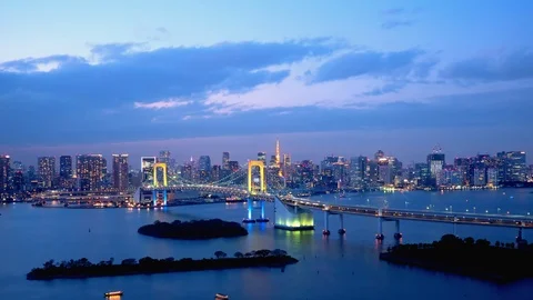 TimeLapse - Daytime to night scenery in Tokyo and Tokyo bay - Tilt up Stock Footage 99705456
